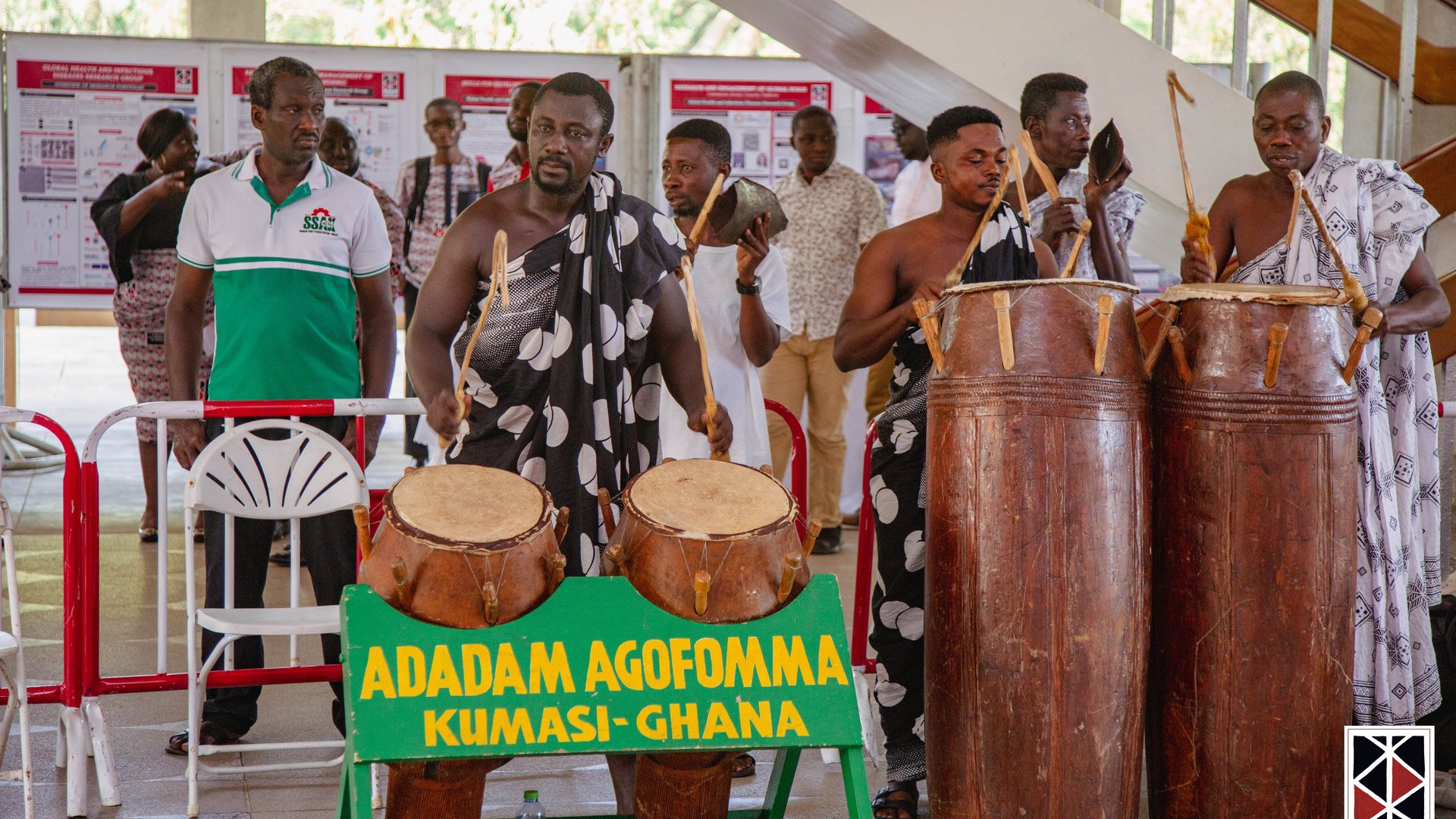 The photo shows a traditional Ghanaian drum group announcing the arrival of the King.