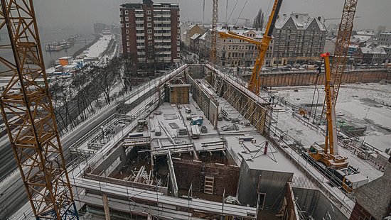 A bird's eye view of a construction site in winter.