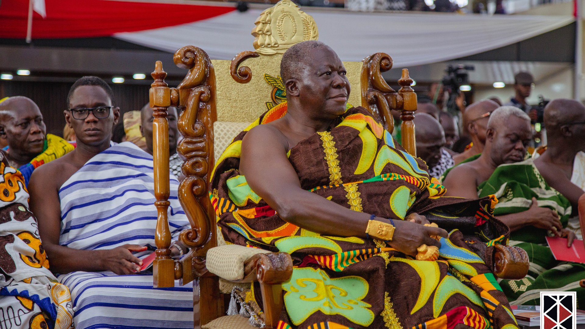 The photo shows the King, Asantehene Otumfuo Osei Tutu II, in the front row of the university's packed Great Hall.